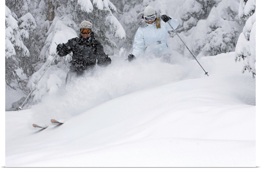 Man and woman snow skiing