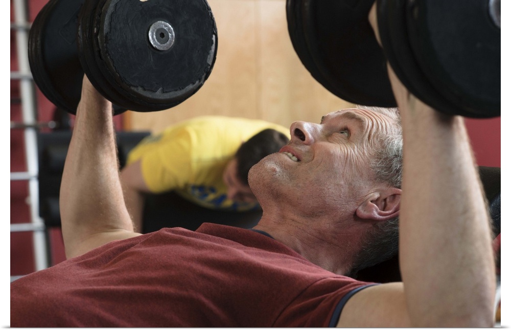Man lifting weights at gym