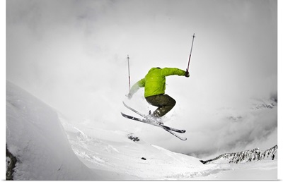 Man ski touring on snow rock in Chamonix, France.