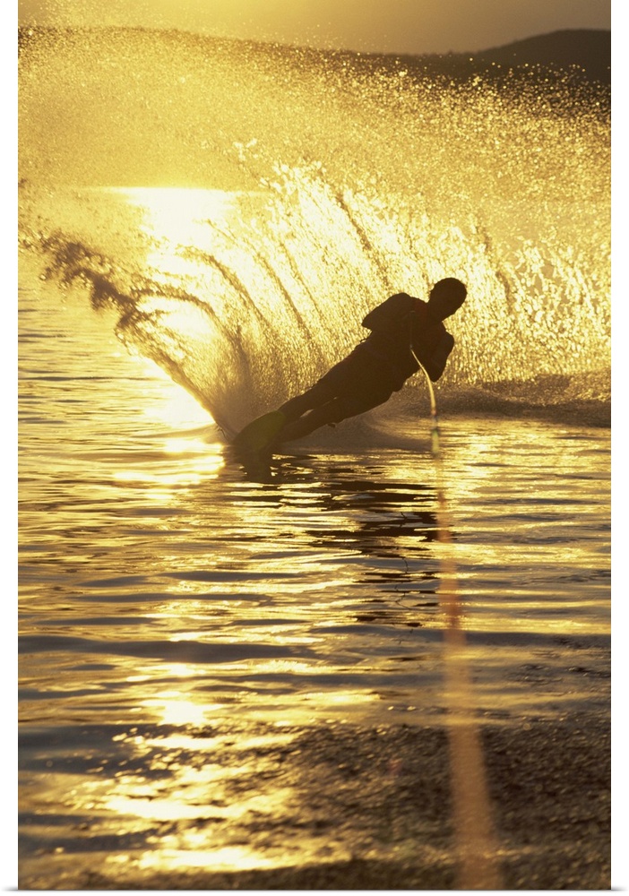 Man water skiing at dusk