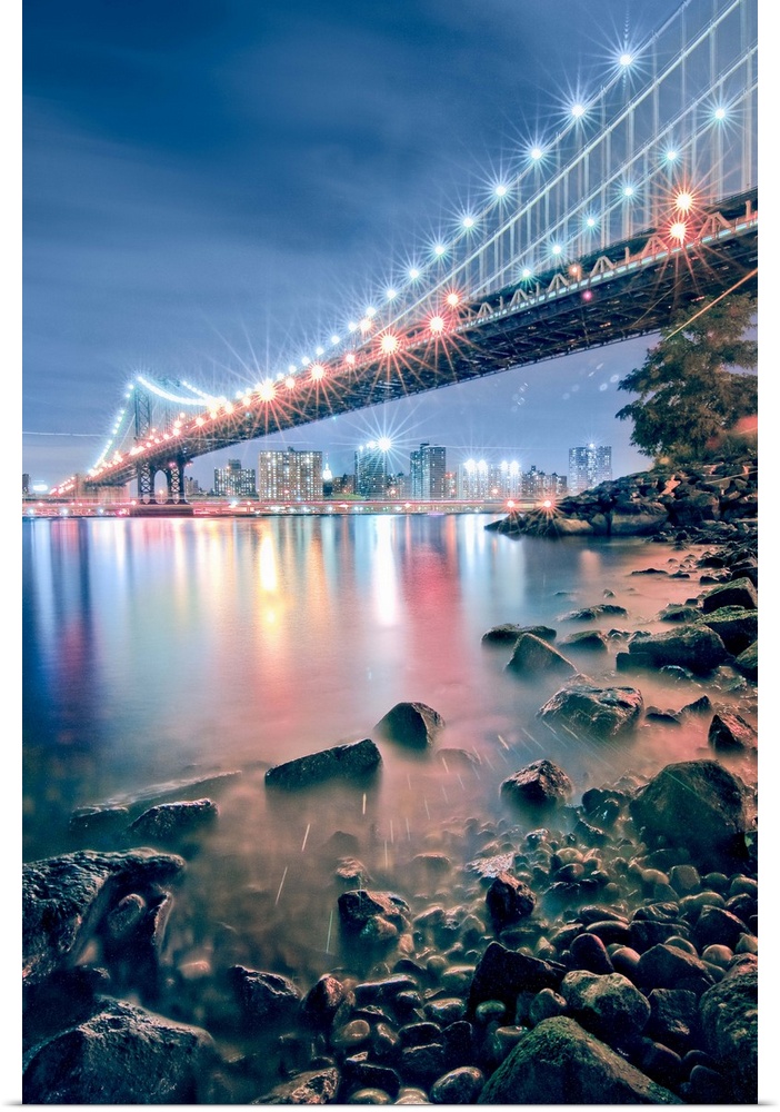 View of Manhattan Bridge from Brooklyn, near the park under the Brooklyn Bridge. At night you can see the skyline and beau...