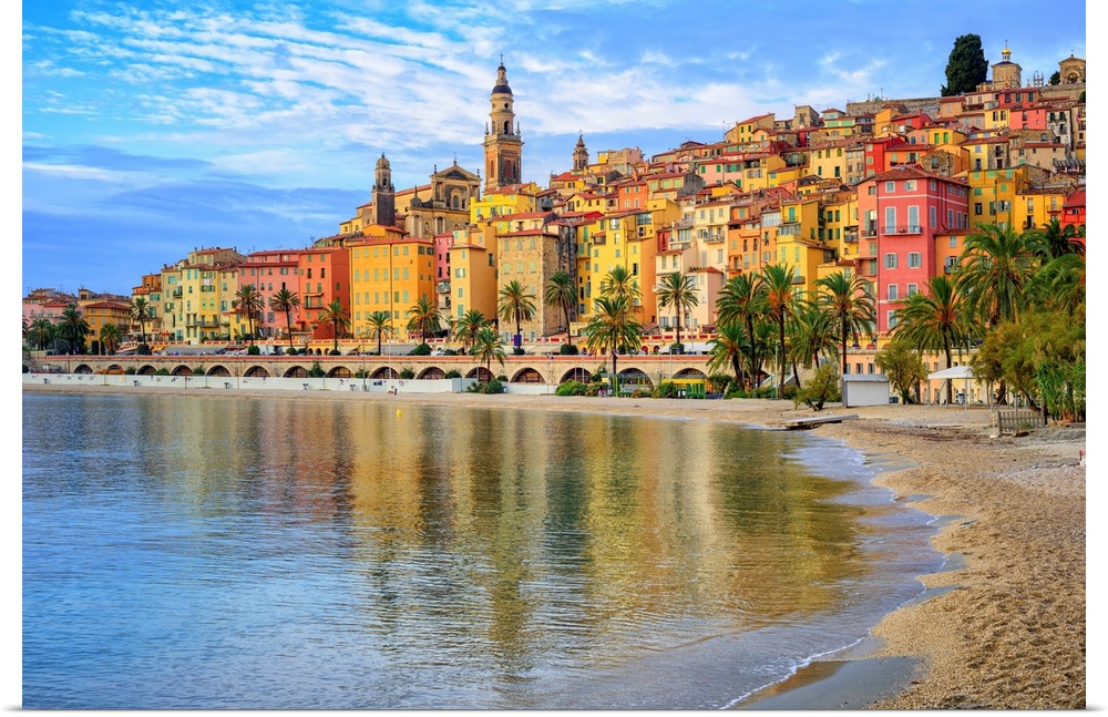 Sand beach beneath the colorful old town Menton on the French Riviera in France.