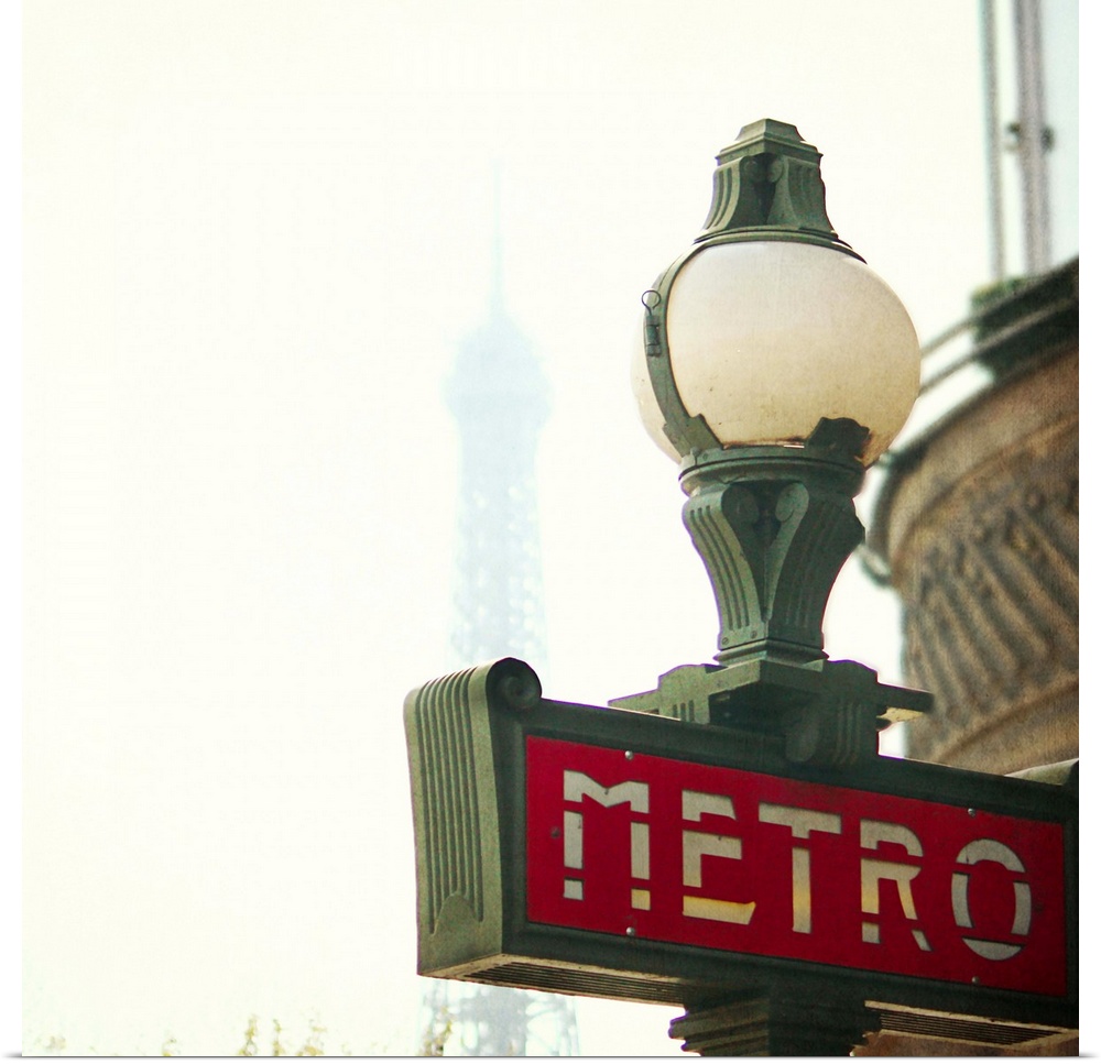 Metro sing in Paris with Eiffel Tower background.