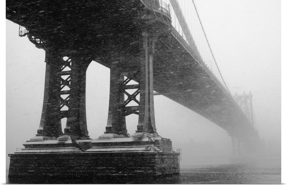 Monochrome image of Manhattan Bridge during winter snow storm.