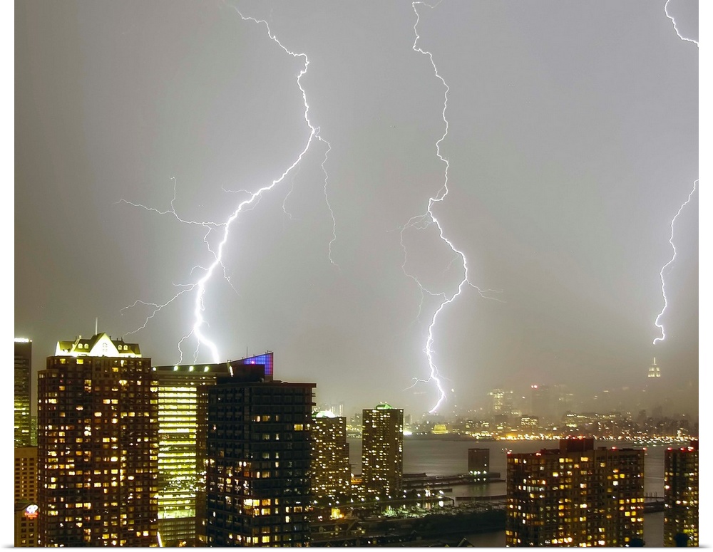 Multiple dramatic lightning strikes viewed from Jersey City, New Jersey looking towards New York City. The Empire State Bu...