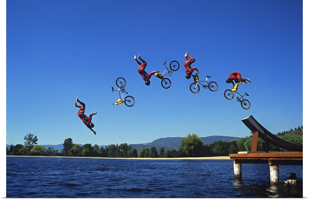 Multiple exposure of cyclist going off jump into water