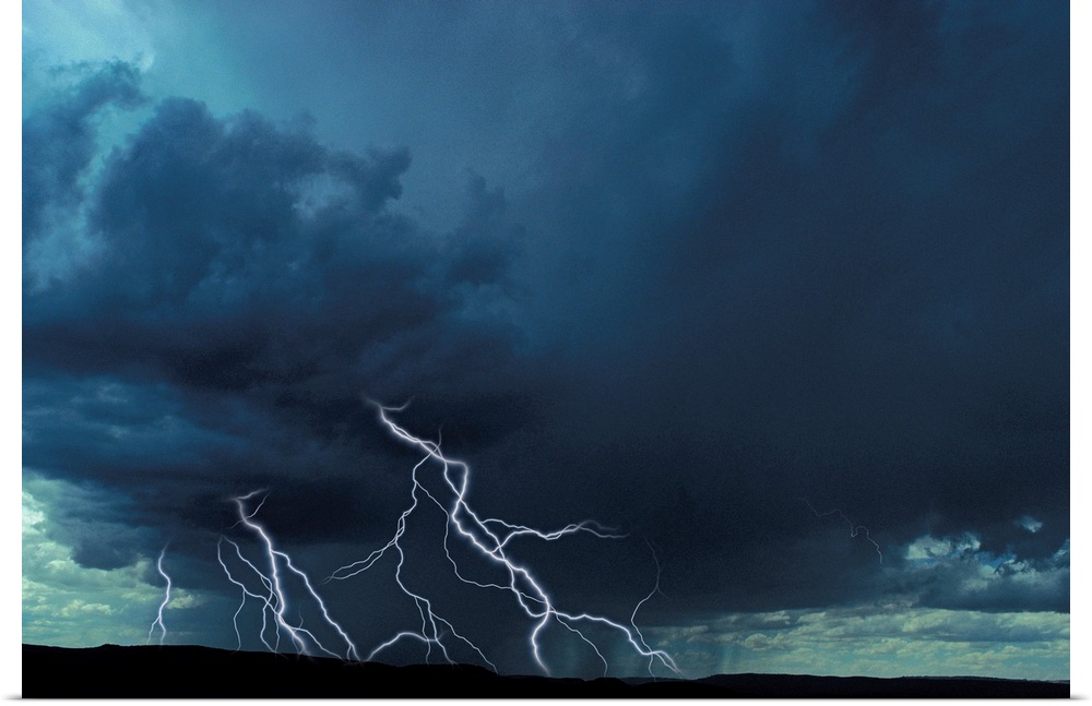 Multiple lightning bolts over rural landscape