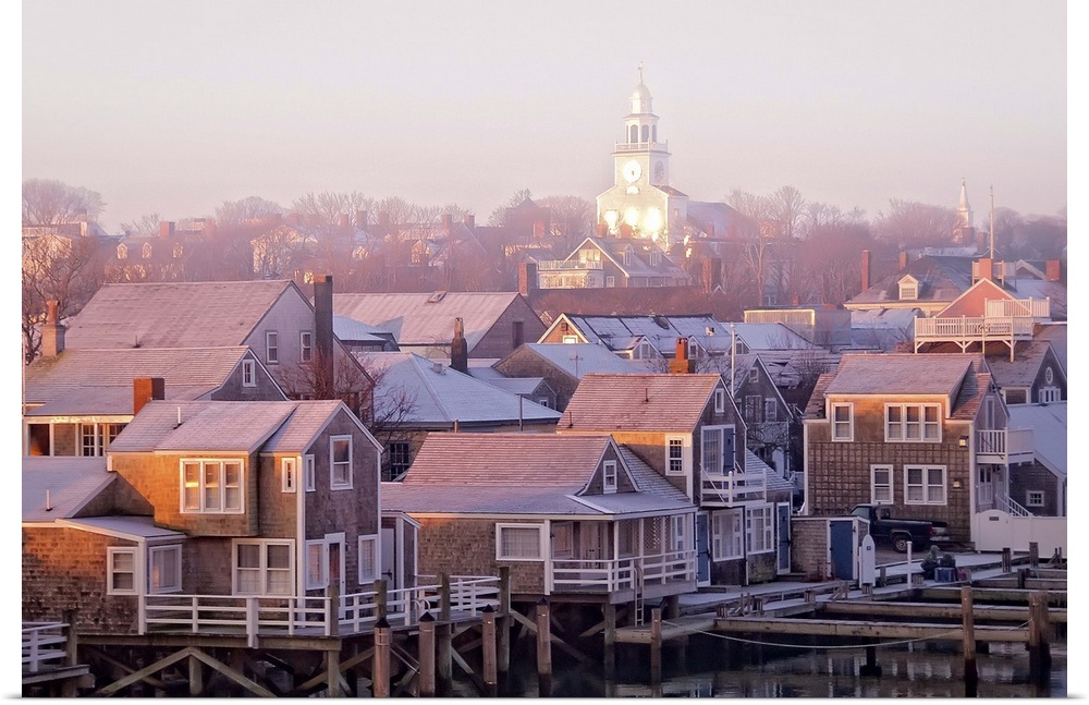 Nantucket town at sunrise in the fog.