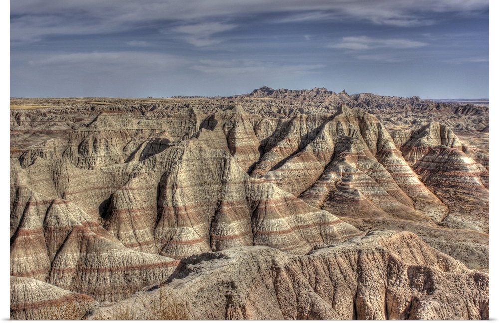 Natural formations in Badlands of South Dakota, showing striations and contours.Hills show erosion and effects of time.