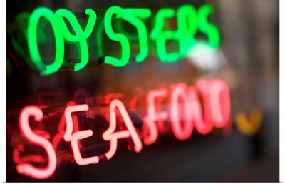 Neon oysters and seafood sign