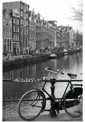 Netherlands, Amsterdam, bicycle parked by canal (B
