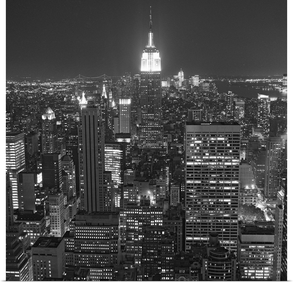Photograph of skyscrapers and skyline lit up after dark in the "Big Apple."
