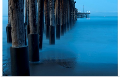 Ocean and dock pilings at beach