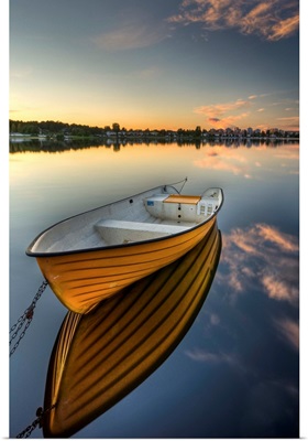 Orange boat with strong reflection sunset in Karlstad, Sweden.