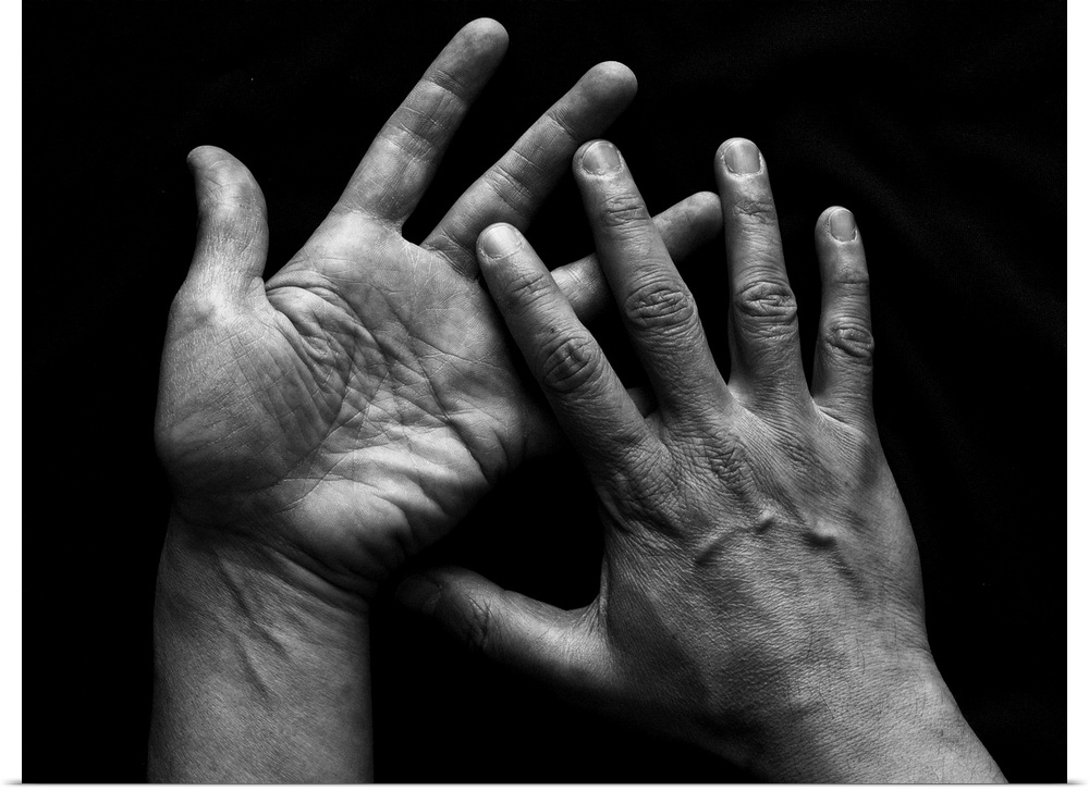 Human pair of hands on black background.