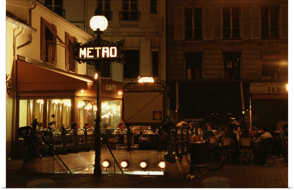 People eating at cafe in Paris at night
