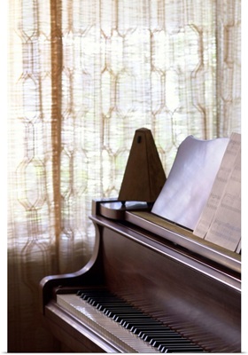 Piano with metronome and sheet music