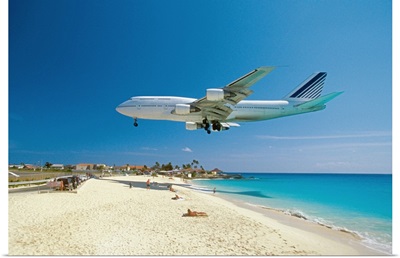 Plane coming in for landing on Maho Bay Beach, Saint Martin, Caribbean