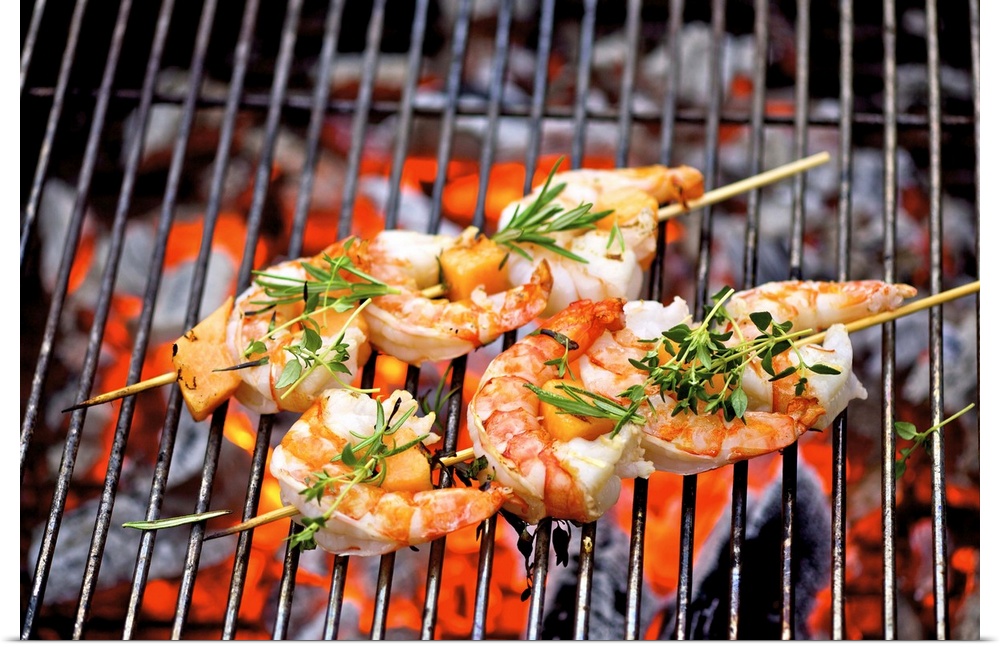 Prawn skewers on barbecue, close-up
