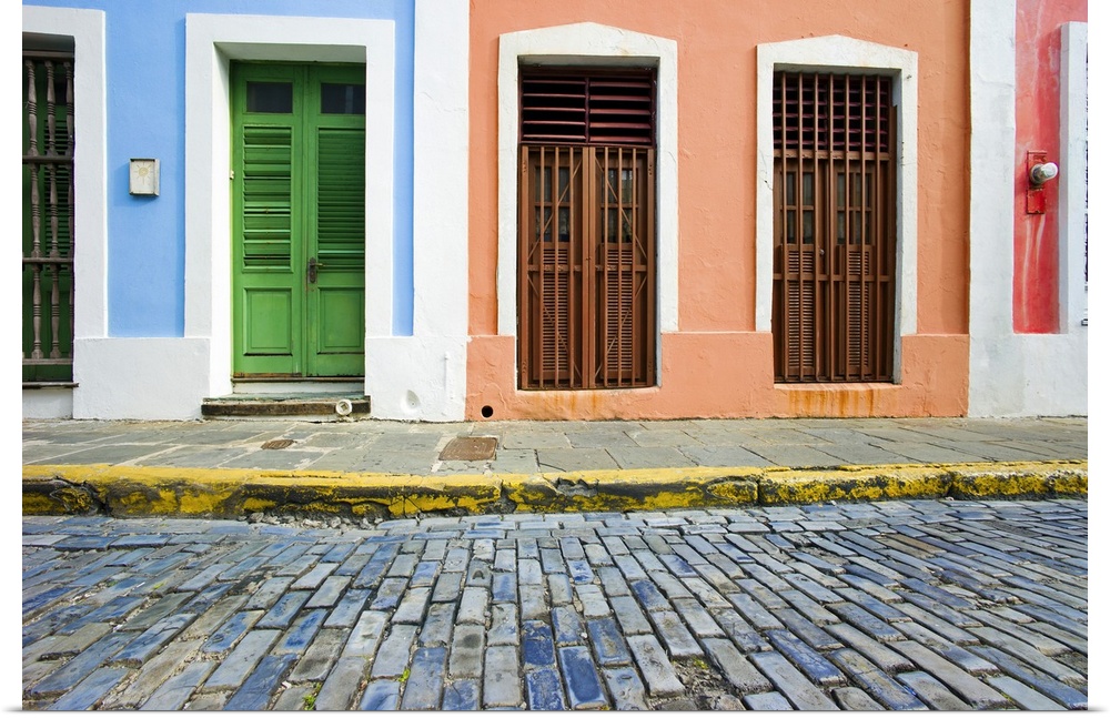 This is a horizontal photograph of an urban landscape of doorways to colorful houses.