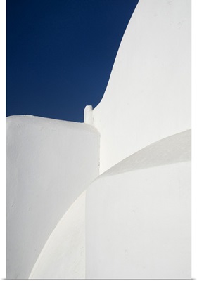 Pure white church against blue sky on greek island of Paros