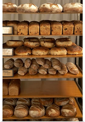Rack with loaves of bread in bakery