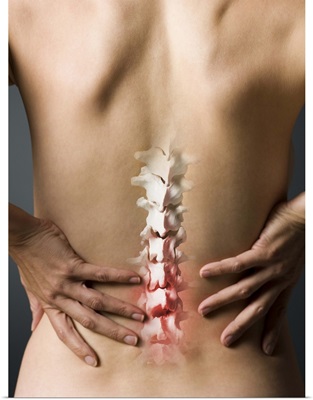 Rear view of woman with hands on back and sore spine