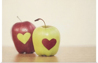 Red and green apple with heart shape.