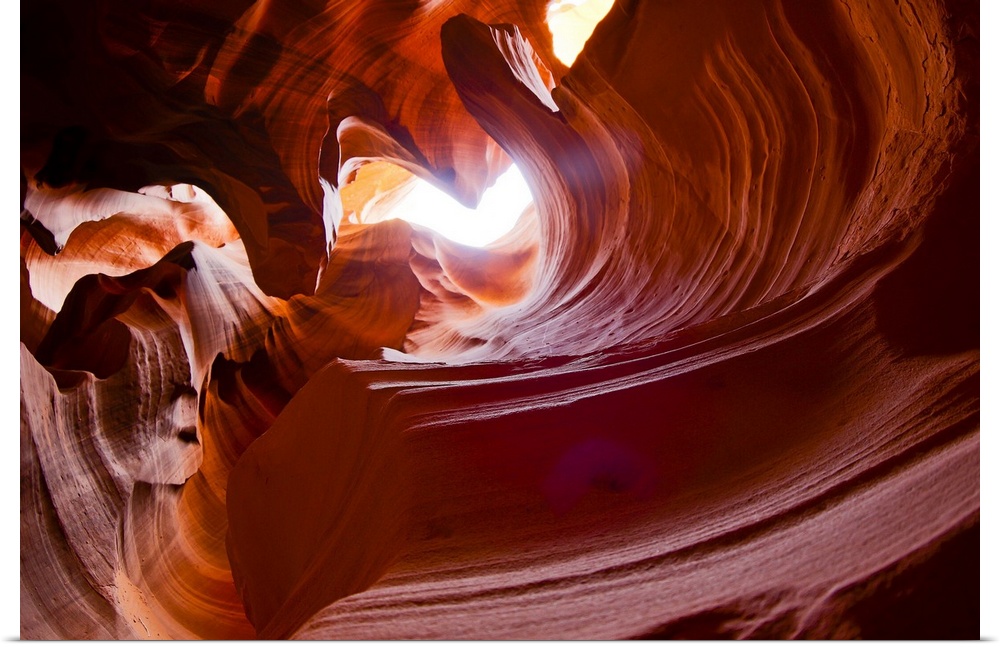 Waves of rock are shown in Antelope slot Canyon. Rock pattern formed over millions of years of flash flooding, now dry 1/4...