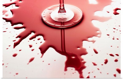 Red Wine Spilled Around Glass