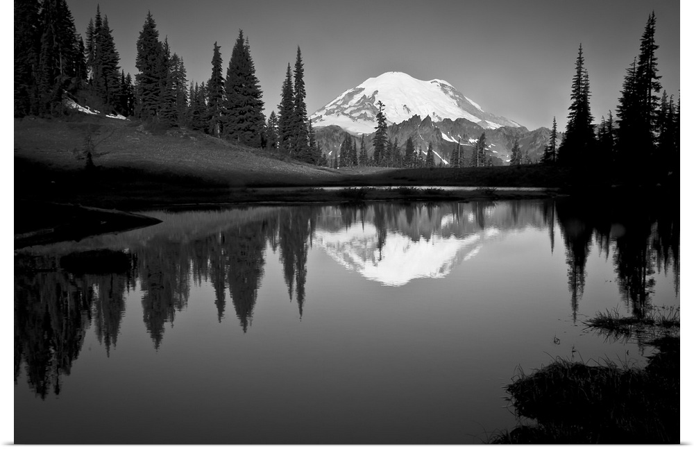 Reflection of Mount Rainer in calm lake at dawn.