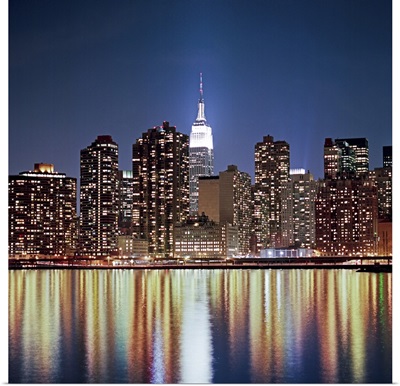Reflection of skyline at night, New York, USA.