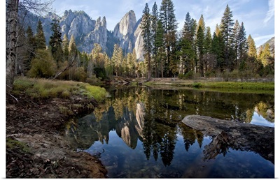 Reflections of Cathedral Peaks along Merced River in Yosemite National Park.