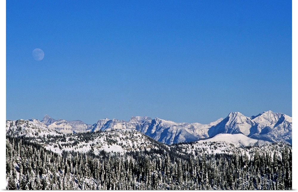 Rocky Mountains & spine of Continental Divide in Glacier National Park, MT during winter seen from Whitefish Range.