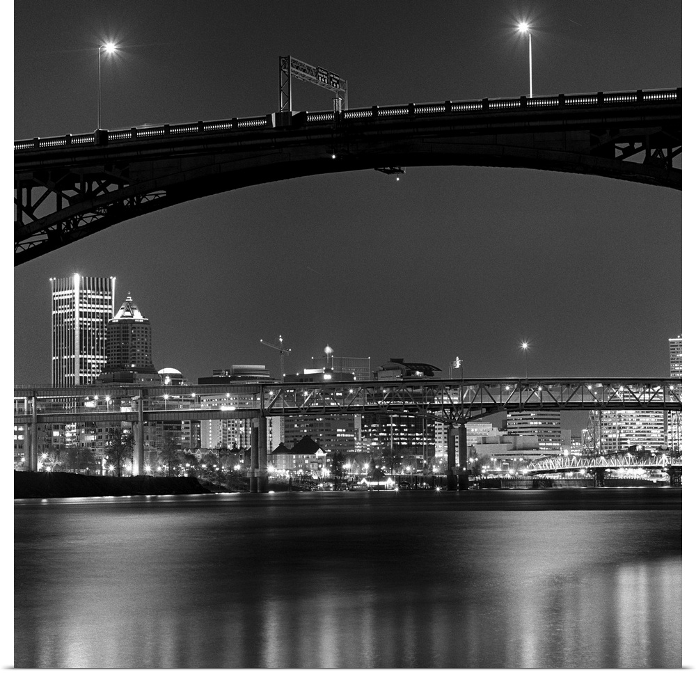 Ross Island bridge at night with city of Portland, Oregon in background, US.