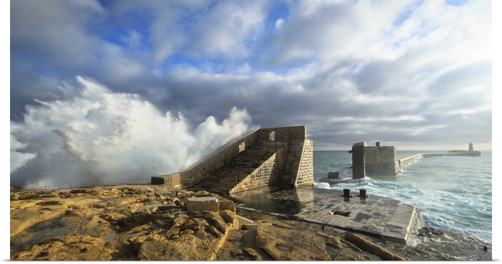 Rough seas crashing against one of Malta's most prominent breakwater.