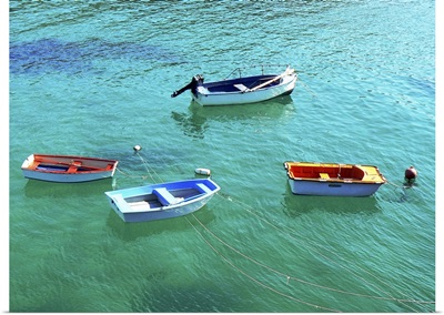 Row boats on turquoise water