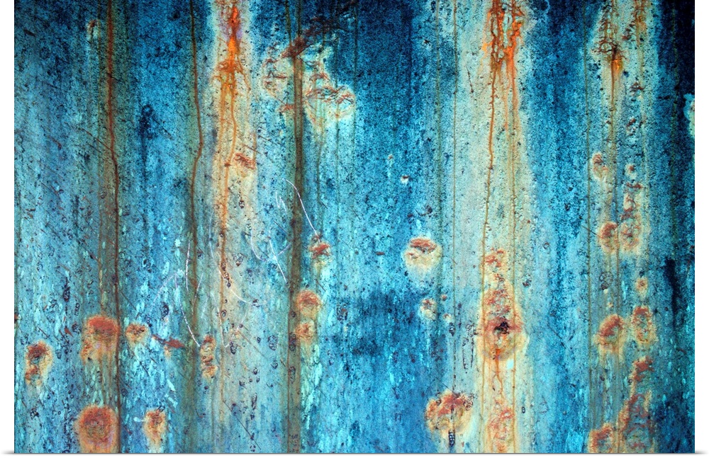 Large photograph shows a rough textured surface that has been heavily affected by oxidation and corrosion.