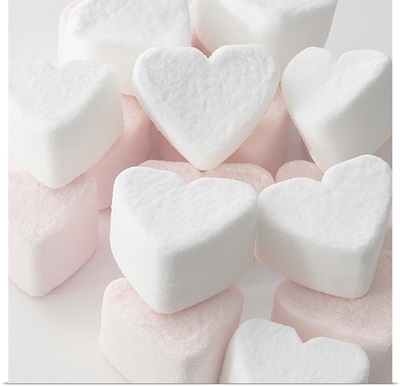 Selection of pink and white heart shaped marshmallows.