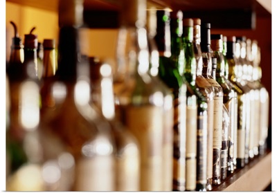 Shelf of liquor bottles (differential focus