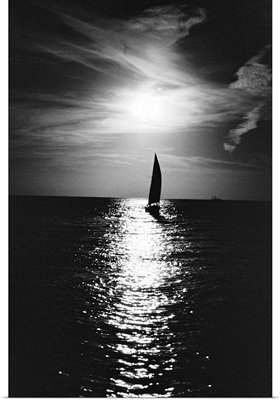 Silhouette of sailboat at sea