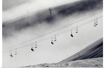Skiers on a chair lift