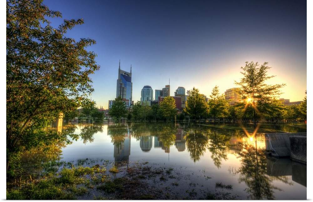 Skyline of Nashville reflection in water at sunset.