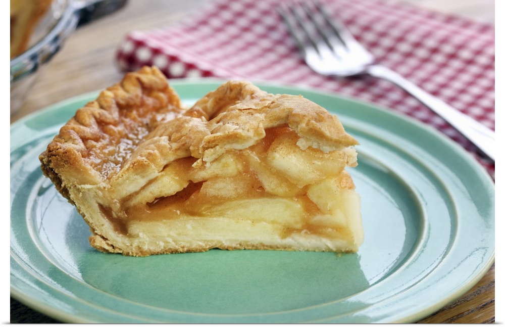 Slice of fresh baked apple pie on plate