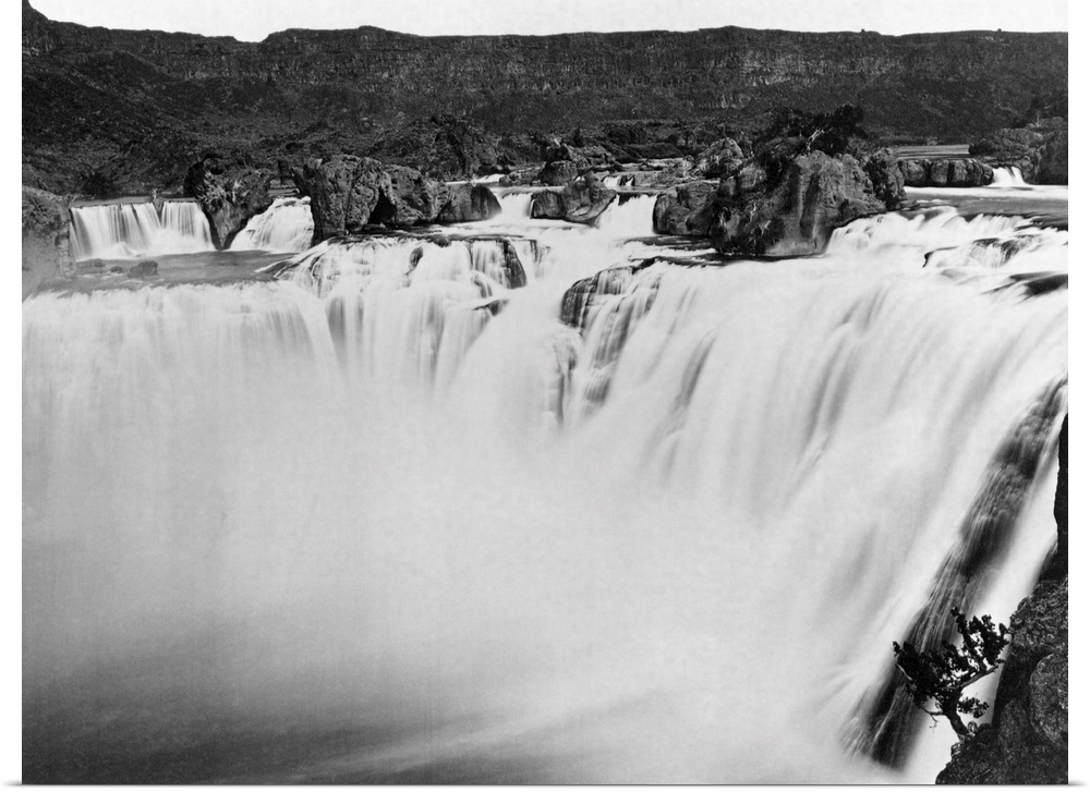 The Snake River rushes over the 212 foot drop that comprises Shoshone Falls. The falls are higher than Niagara's and attra...