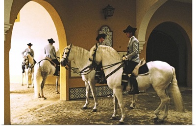 Spain, Jerez de la Frontera, School of Equestrian Art, four men on horses