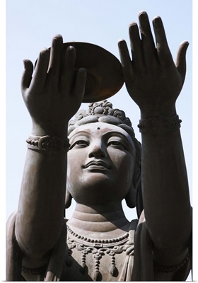 Statue of Buddha against blue sky