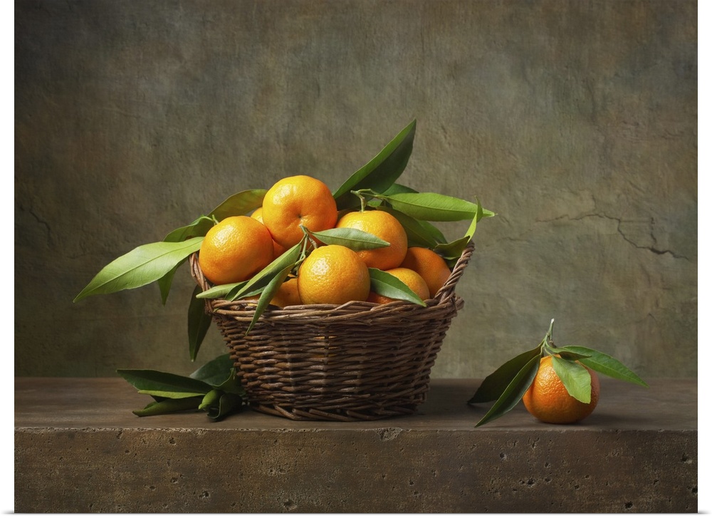 Still life with tangerines in a basket on the table.