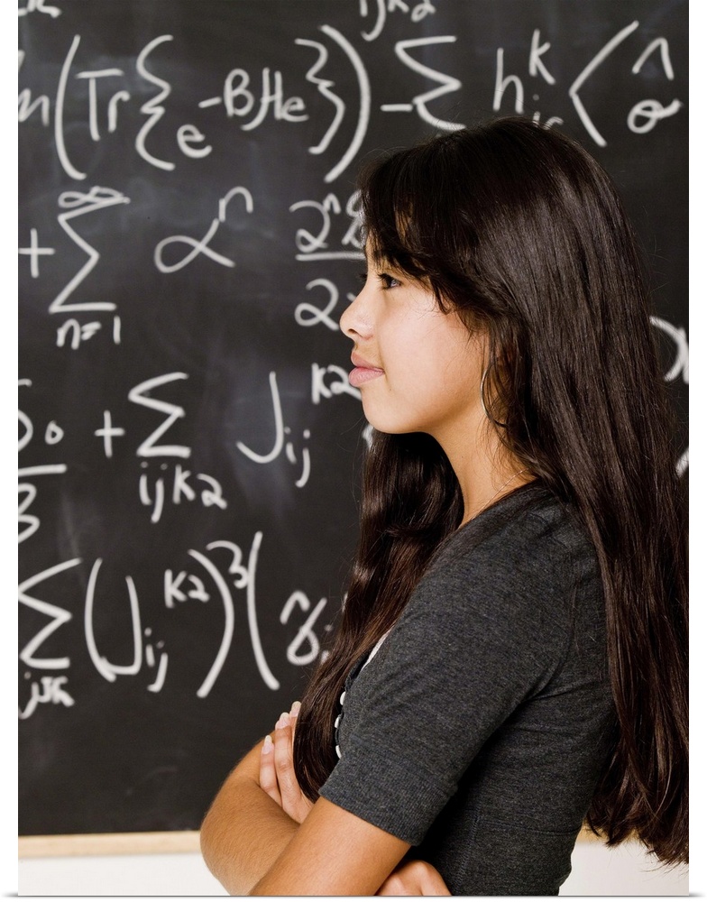 Teenage girl student at blackboard with math equations