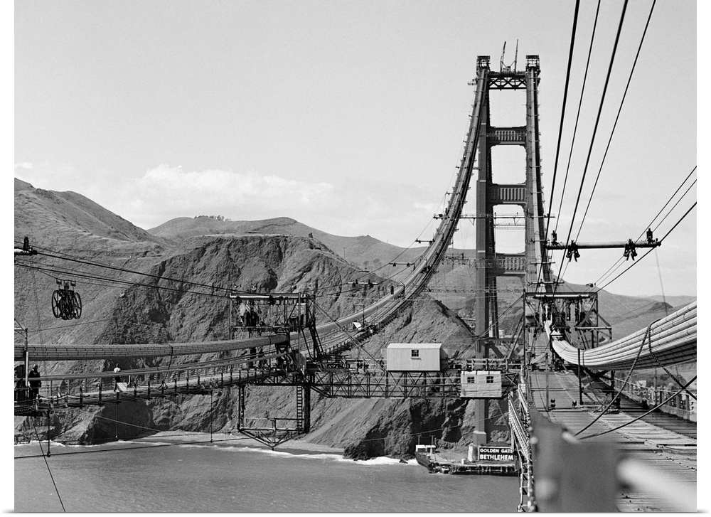 Looking from San Francisco toward the marine shore at the construction of the Golden Gate Bridge.